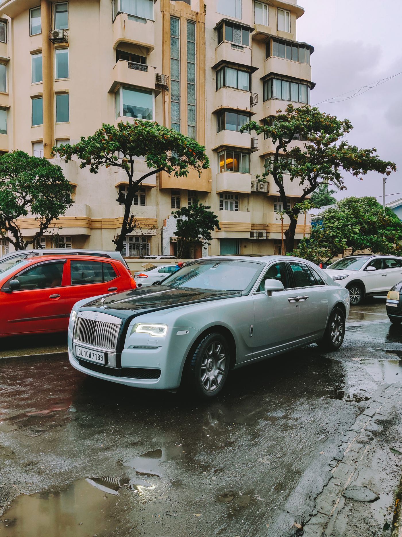 Silver Rolls-Royce Ghost in the rain