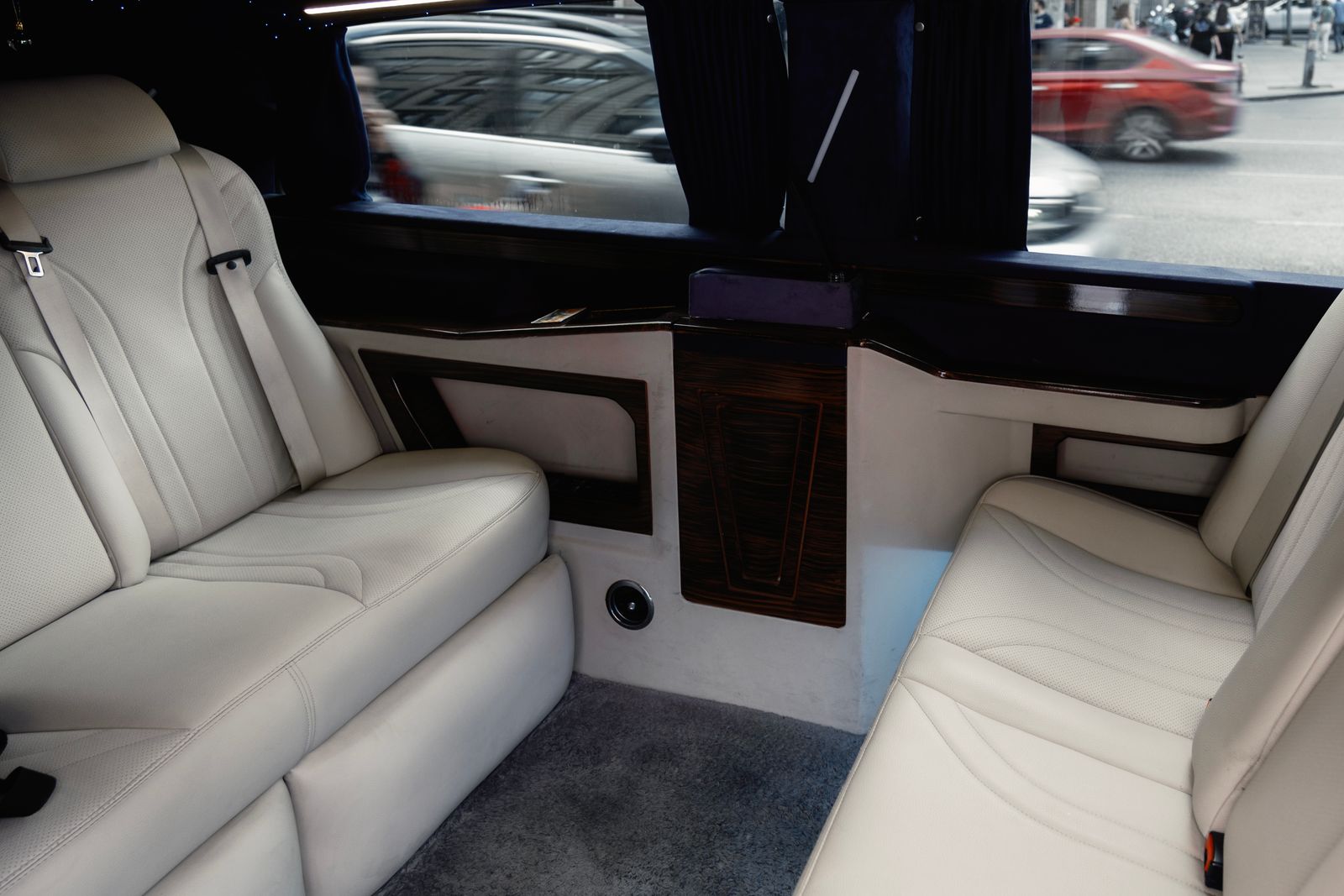 White leather rear cabin of a Rolls-Royce